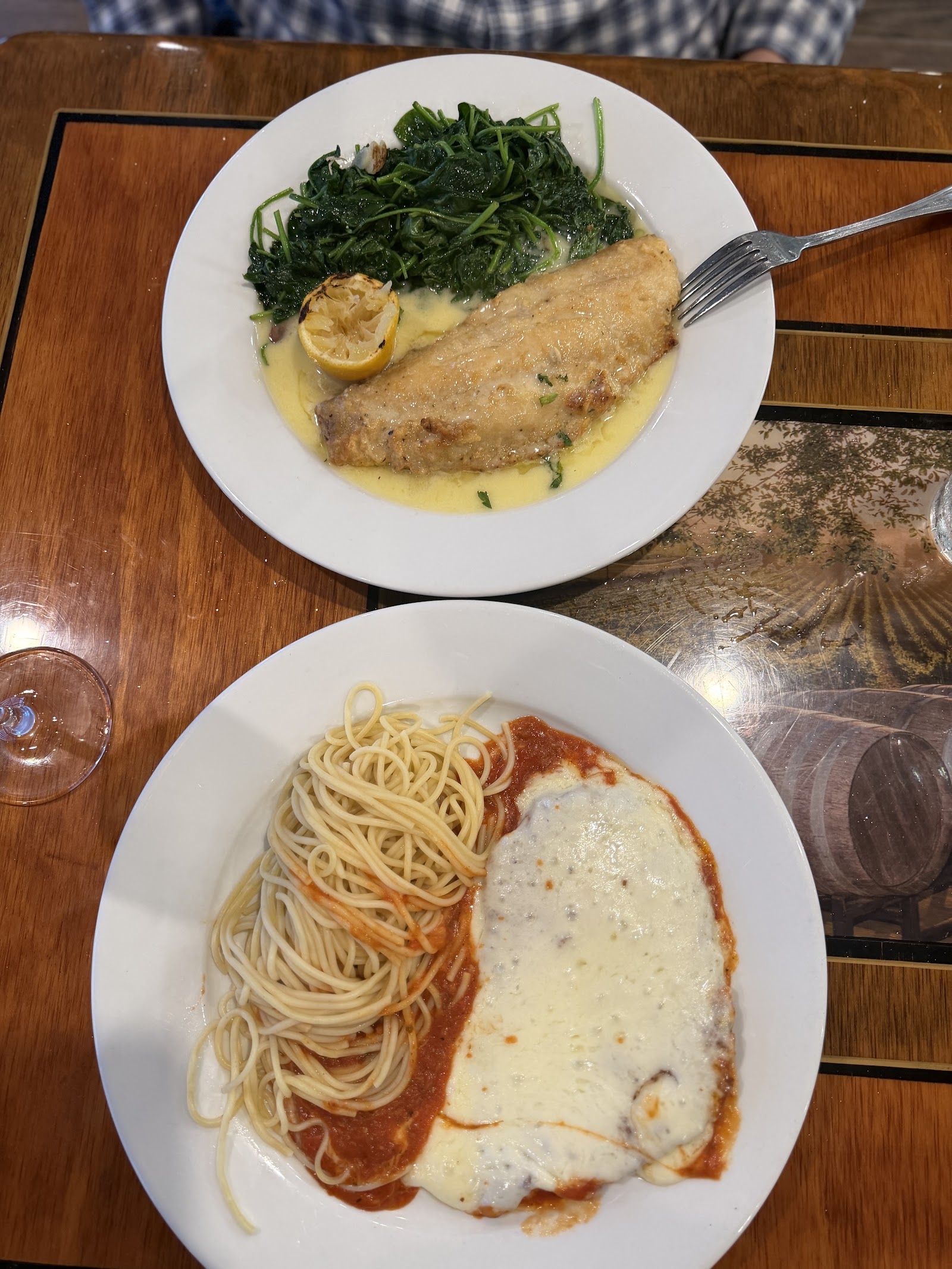 Fish Florentine and chicken parmesan with spaghetti at Casa Mía